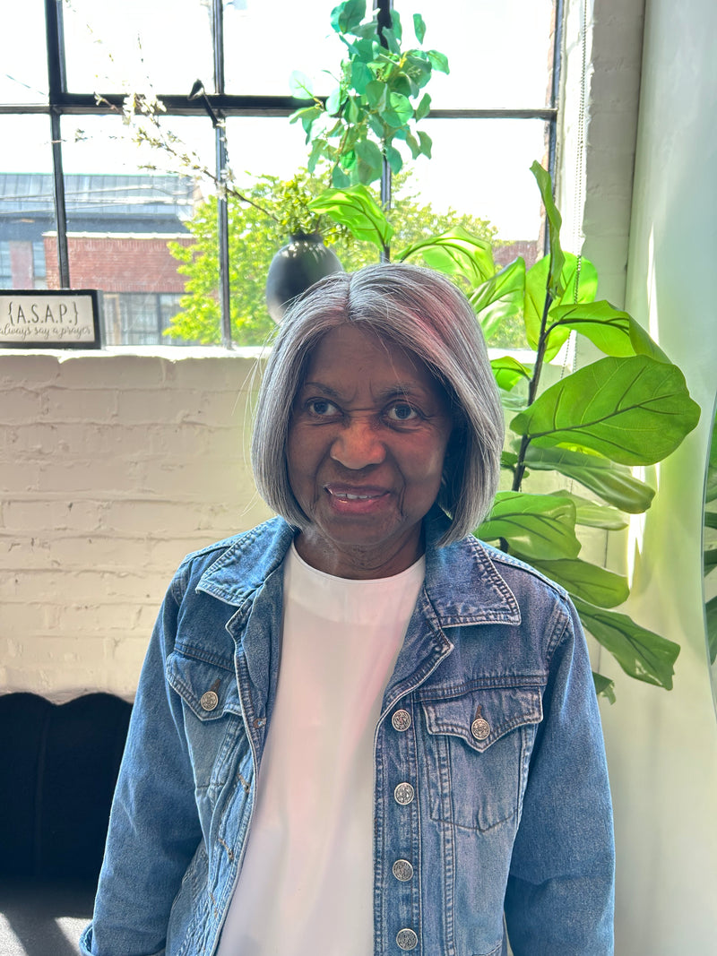 Black Woman with a grey bob grey cranial prosthesis at The Chic Studio