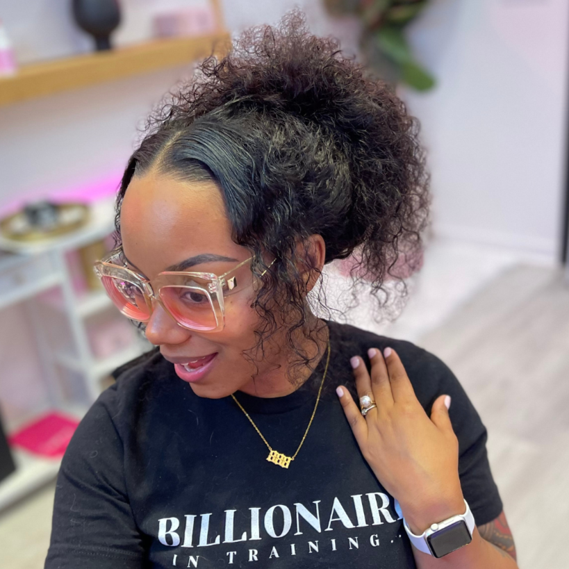 Black woman wearing a u part deep wave unit with a natural hairline that is sewn down