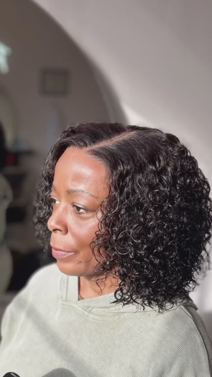 Video of a Veteran wearing curly bob cranial prosthesis at The Chic Studio